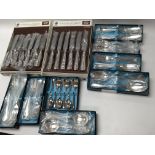 Boxes of unused silver plate cutlery still in orig