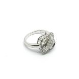 An 18ct white gold ring set with baguette and bril