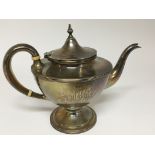 A silver tea pot marked to the base Sterling. Weig