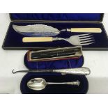 A cased silver spoon together with a boxed set of