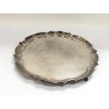 A silver salver with a shaped rim, approx 30cm, Bi