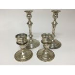 Two pairs of Sterling silver candle sticks loaded