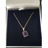 A 14ct amethyst pendant on a chain.