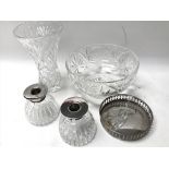 A pair of silver rimmed cut glass candle holders,