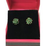 A pair of 9ct gold stud earrings set with a cluste