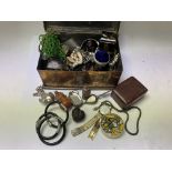 A brass casket with mixed contents of Jewellery an