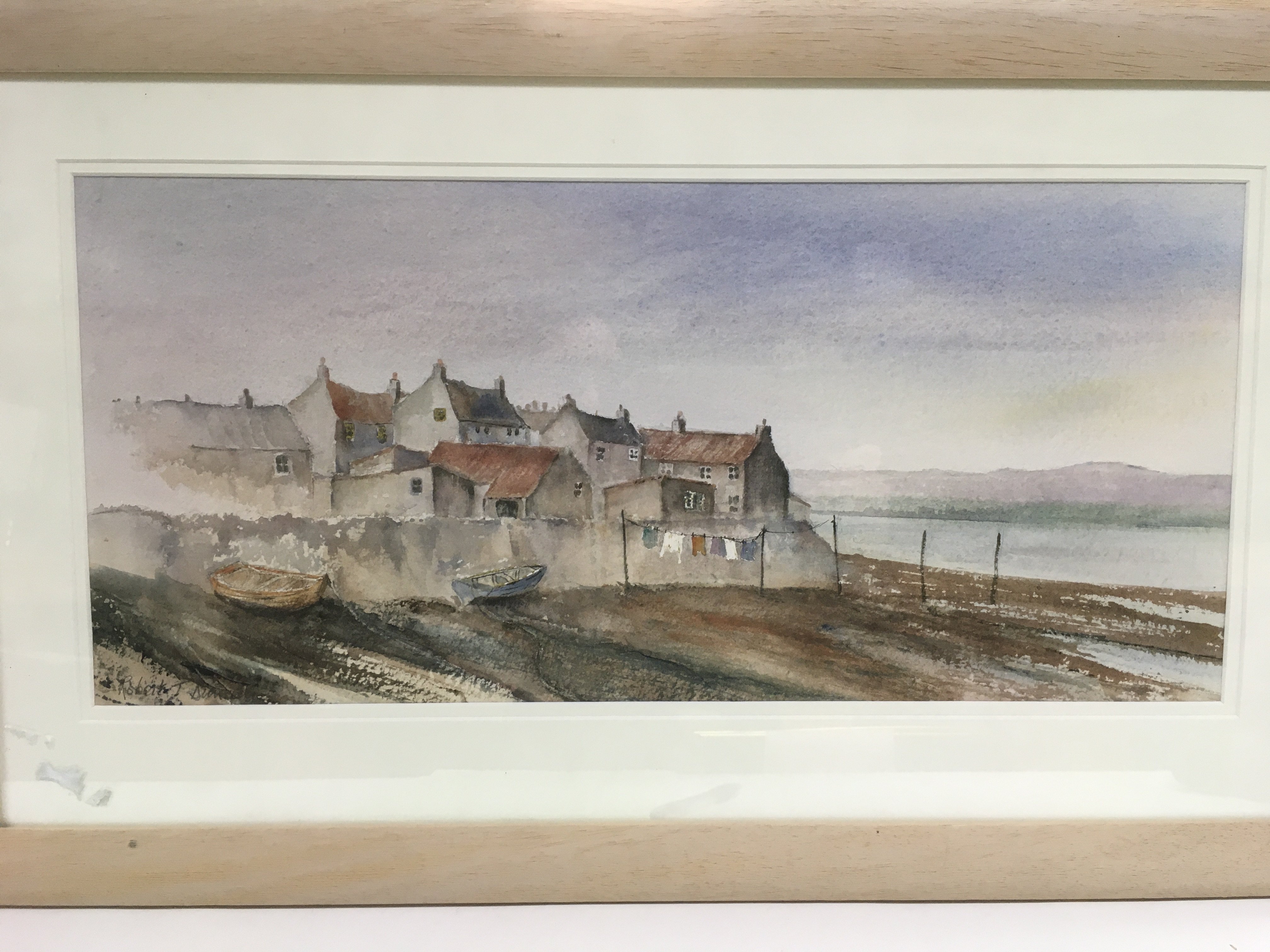 A framed and glazed watercolour of Ravenglass in t