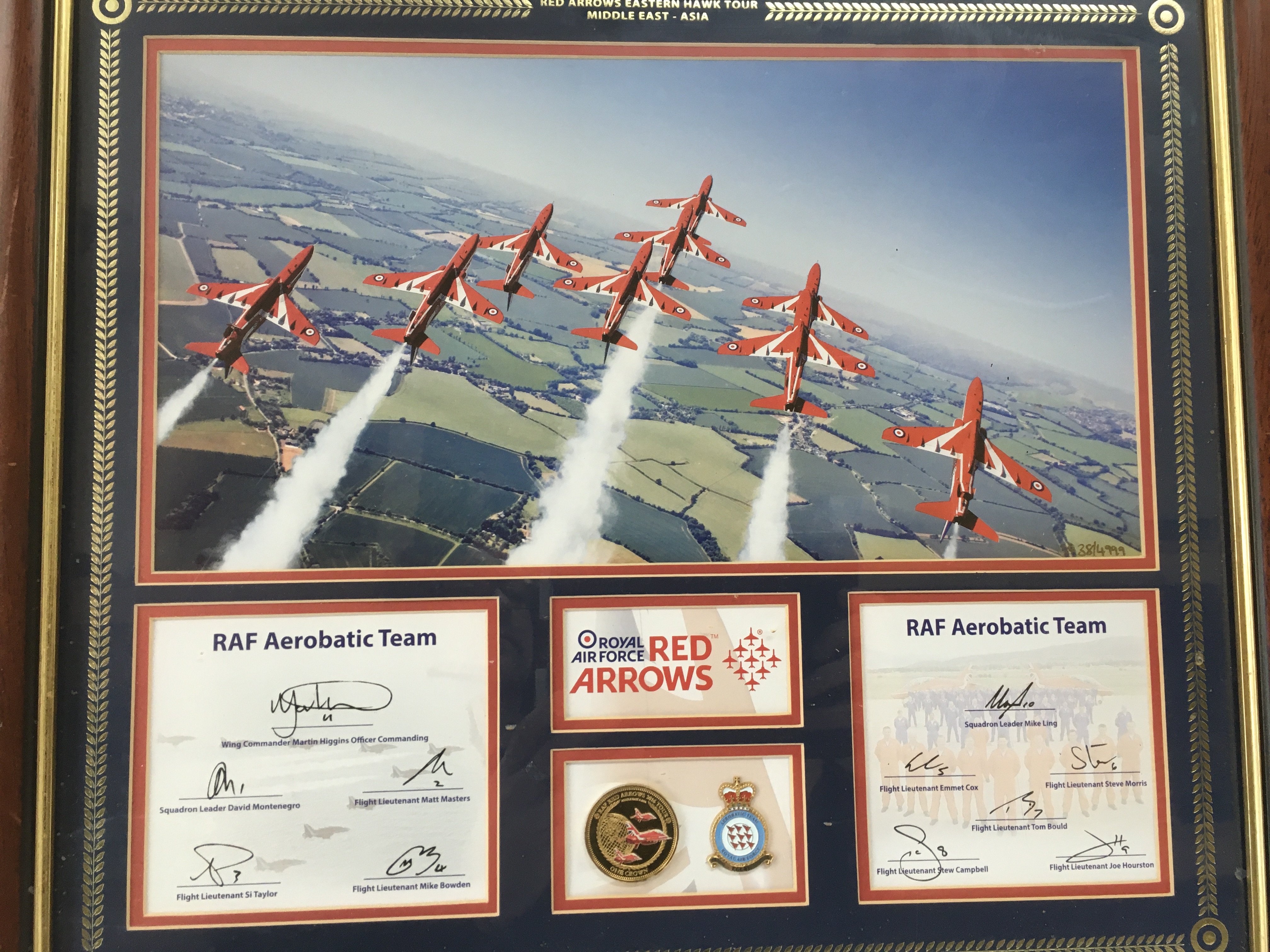 A framed and glazed multi signed Red Arrows display.