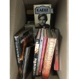 Two boxes of film and music books including many C