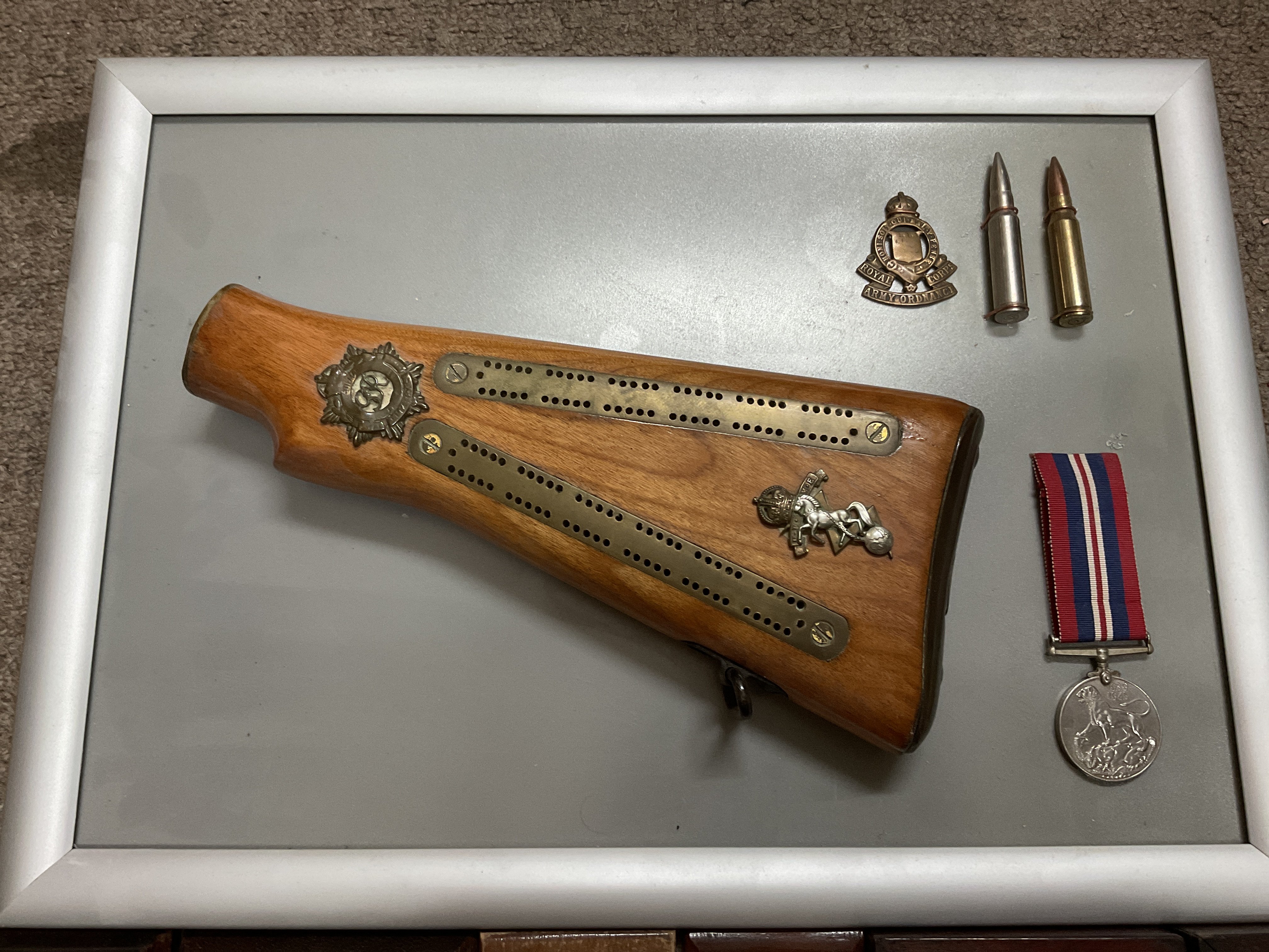 A converted gun stock cribbage board framed with additional military related items together with 4 - Image 2 of 2