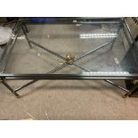 A heavy gilt metal mounted coffee table with glass