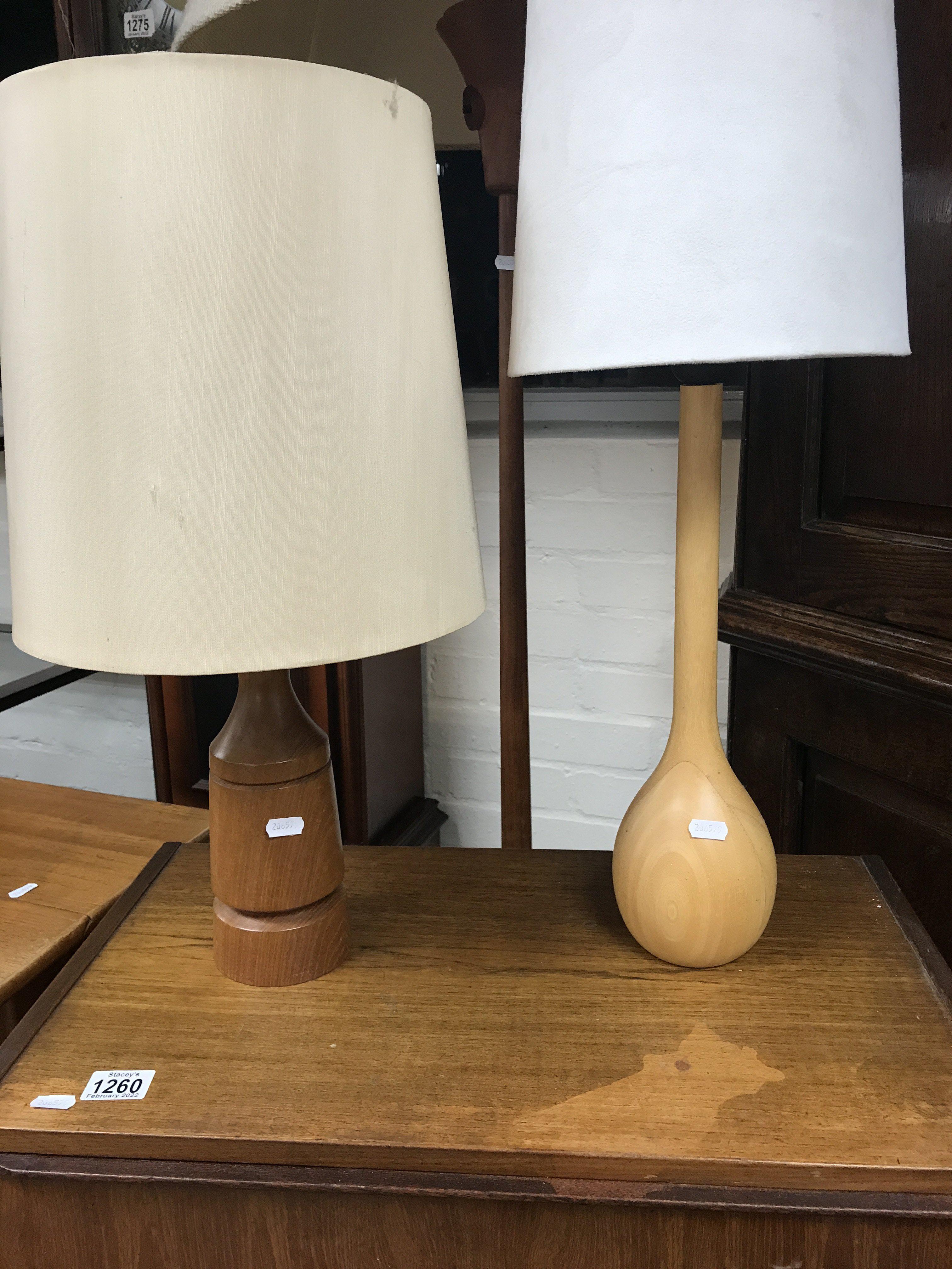 A contemporary standard lamp and two table lamps .