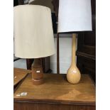 A contemporary standard lamp and two table lamps .