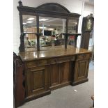 A Victorian oak sideboard the mirror back above th