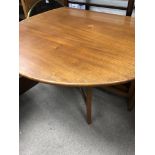 A Drop leaf table and two chairs .