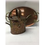 A copper tray and watering can with art Nouveau in