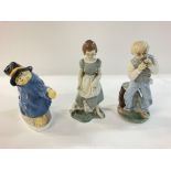 Pair of Irish porcelain figures and a Paddington bear figure.