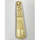 An ivory carved shoe horn.