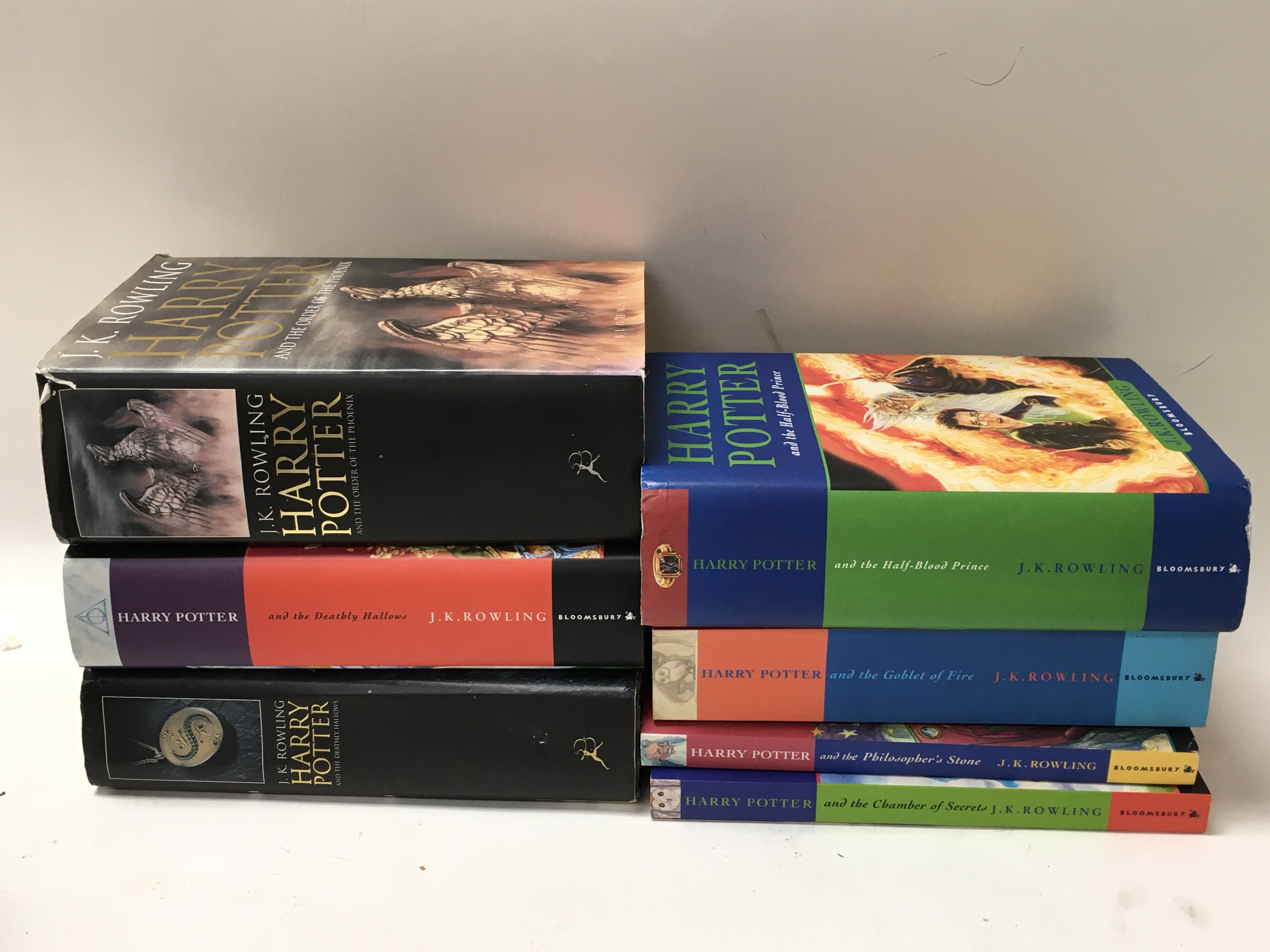 7 Harry Potter books, 4 that are first editions -