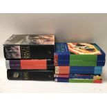 7 Harry Potter books, 4 that are first editions -
