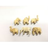 Five ivory elephants and a deer (6), approx 4cm ea