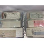 An album of various used and unused world cheques.