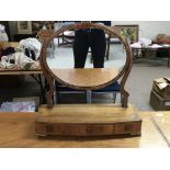 A Georgian dressing table oval mirror with three s