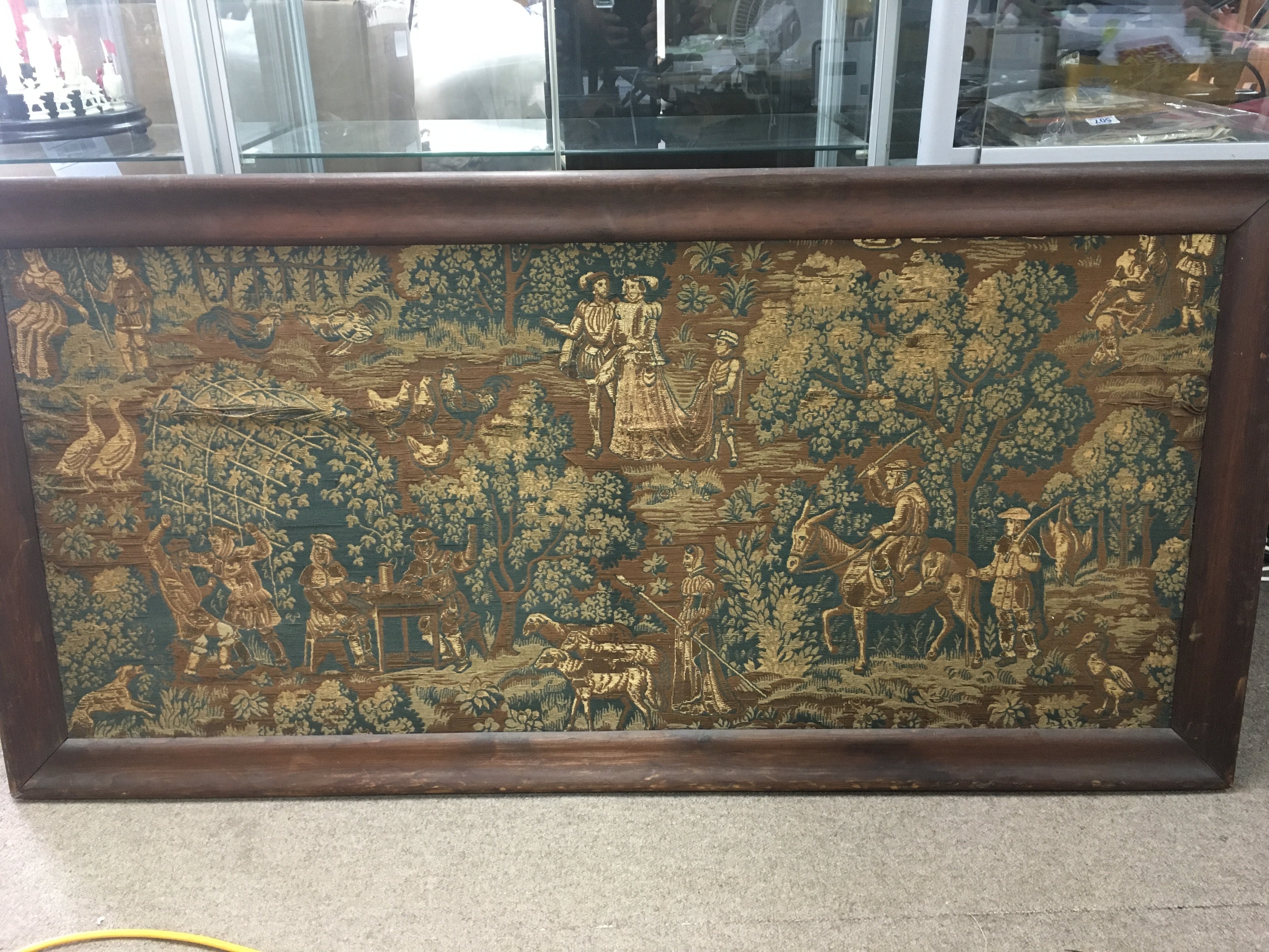 A 17th Century framed tapestry depicting figures i