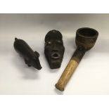 Three carved wood African objects comprising a dec