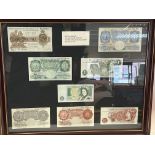 A framed collection of English banknotes from 1920