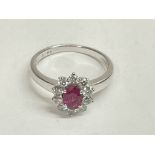 Certified 18ct white gold oval ruby and diamond cl