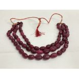 Weighty necklace strung with earth-mined carved ov