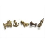 Five 9ct gold charms weighing approximately 24g.