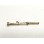 A 9ct gold propelling pencil set with turquoise.