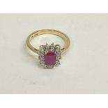 9ct yellow gold step cut ruby and diamond halo rin