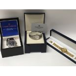 Three boxed wrist watches.