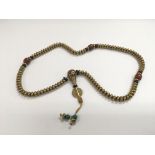 A Tibetan bronze bead necklace.