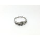 A 9ct white gold ring set with small diamonds, app