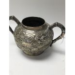A small Chinese twin handle sugar pot decorated wi
