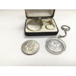 Three silver dollars, two marked for 1880 and susp