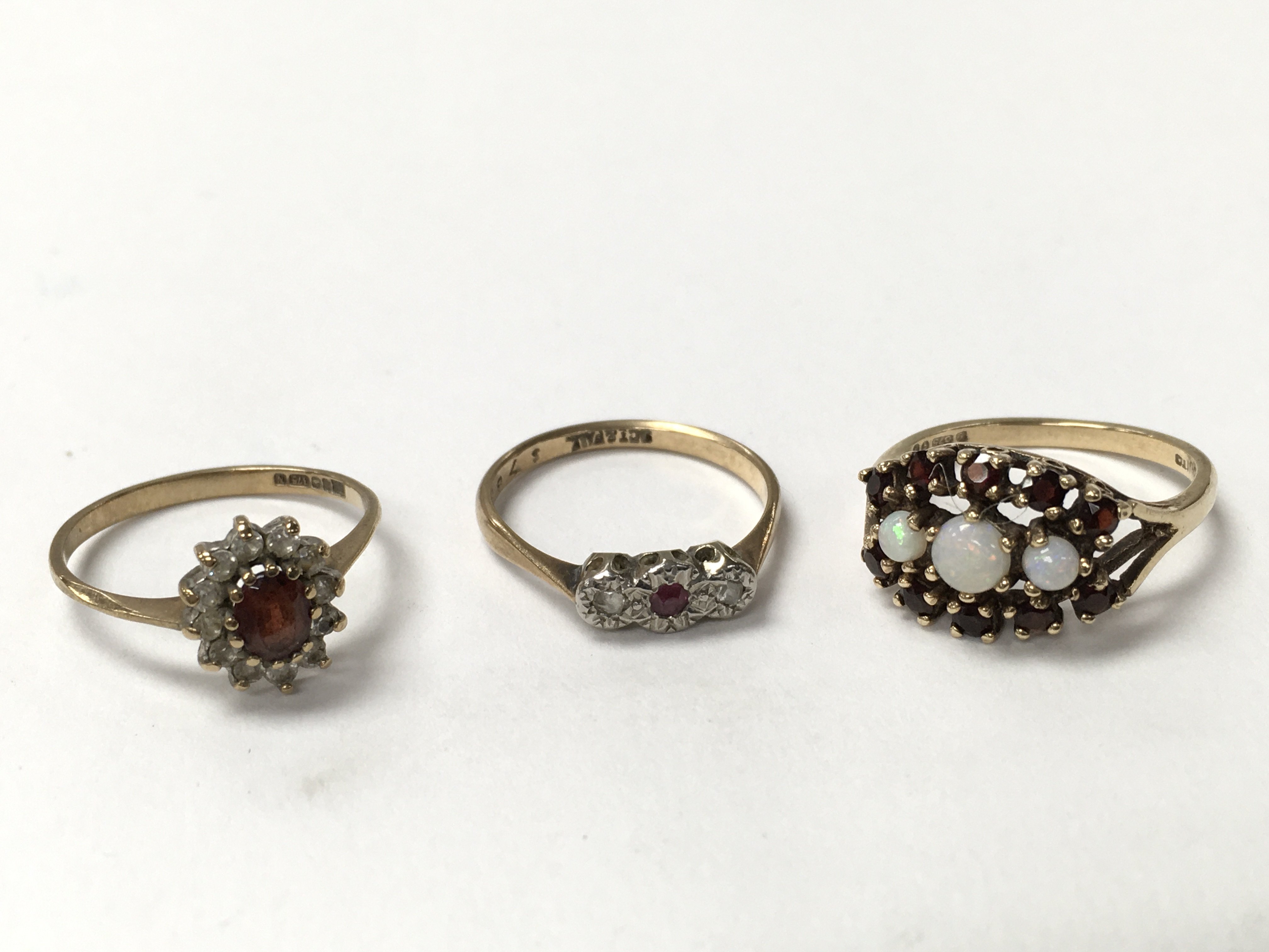 Three 9ct gold stone set rings.