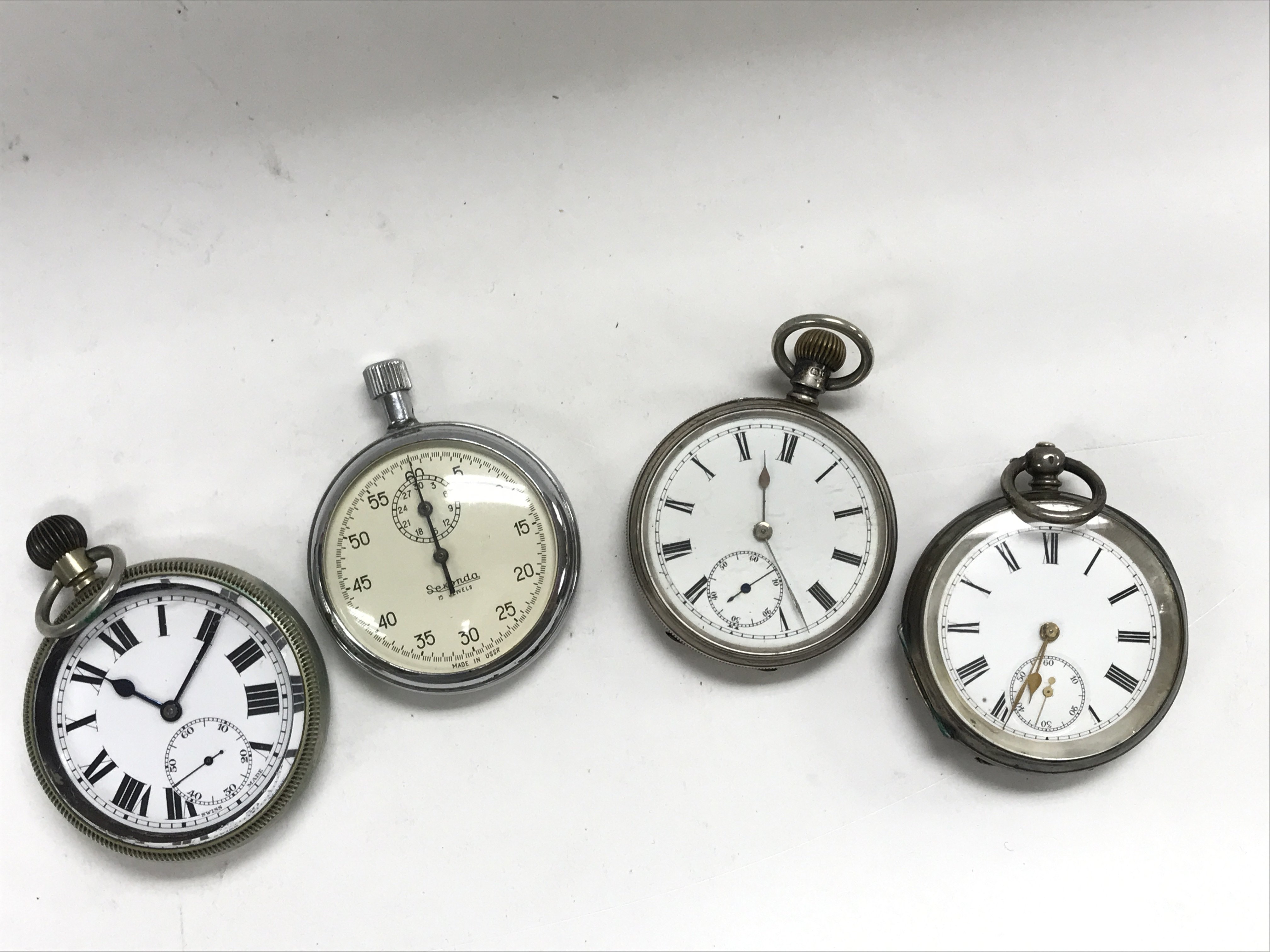 Two silver cased pocket watches, and two others.