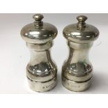 A hallmarked silver cruet set.