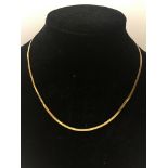 A 9ct gold flat necklace.