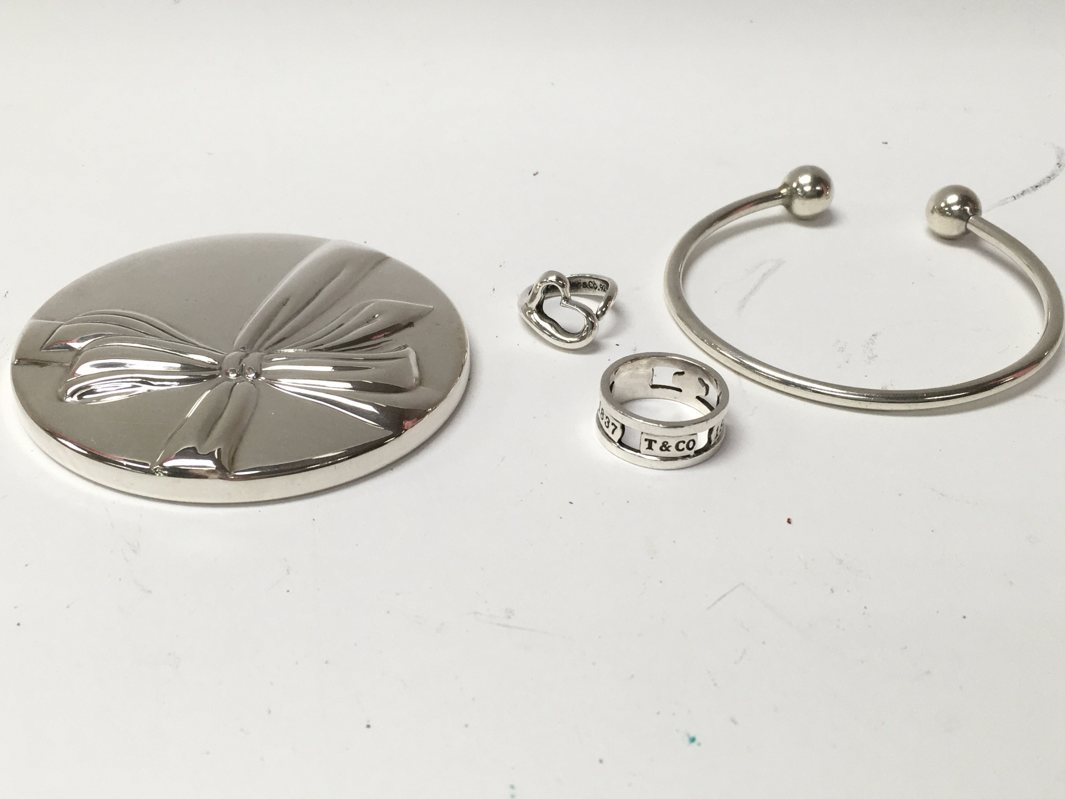 A Tiffany and Co silver bangle with unscrewing end