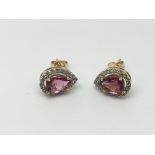 A pair of 18ct earrings set with pink tourmaline a