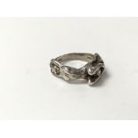 A silver ring cast with erotic decoration, circa 1