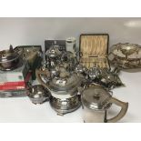 A collection of silver plate a tea set baskets cas