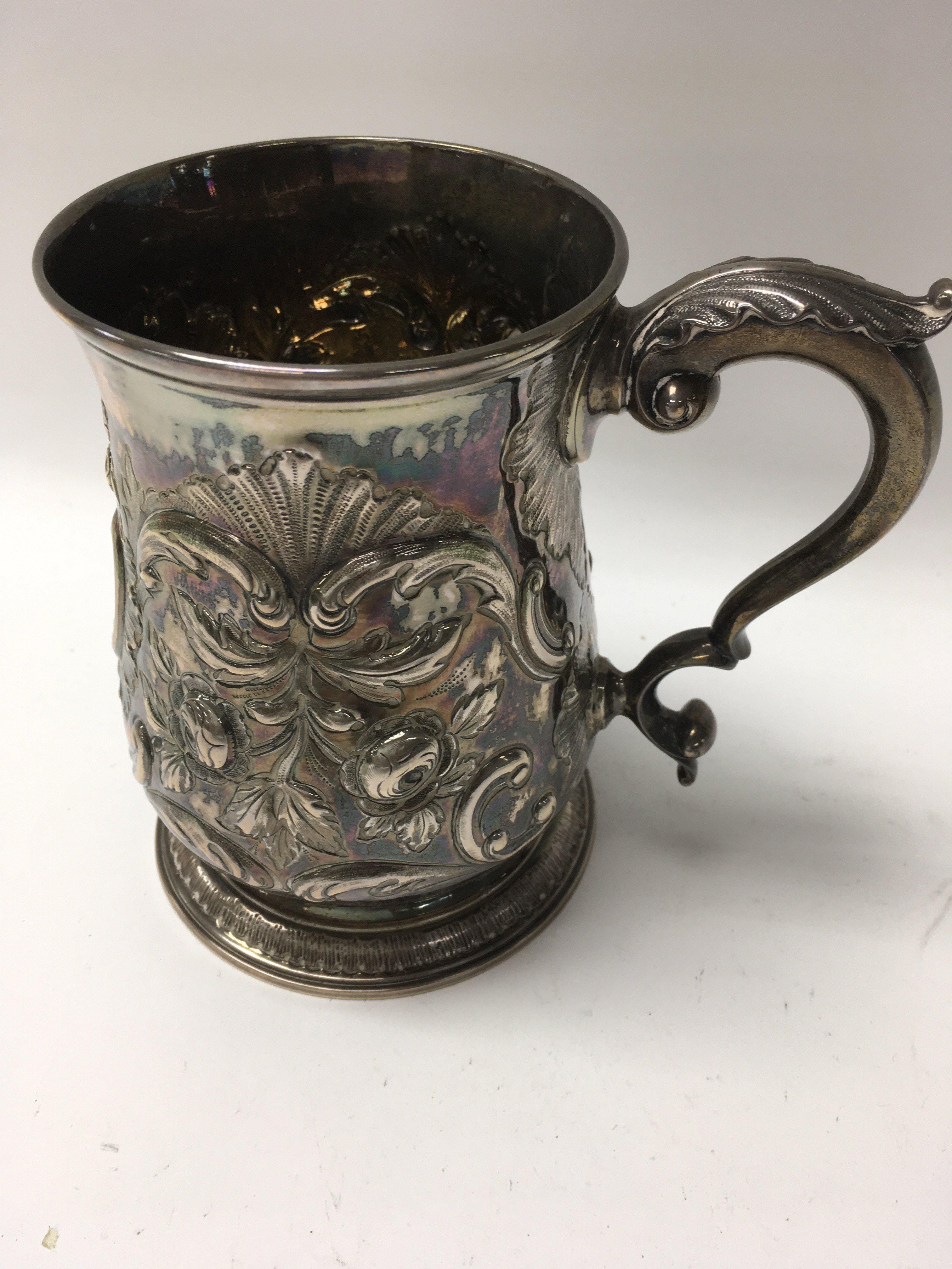 A Georgian silver tankard later inscribed 376 gram