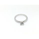 An unmarked white gold diamond ring, approx .50ct,
